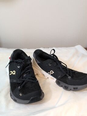 On Running Women's Black Sneakers with White Logo